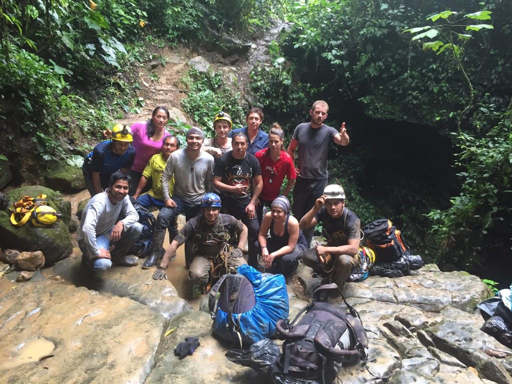 Group in front of cave