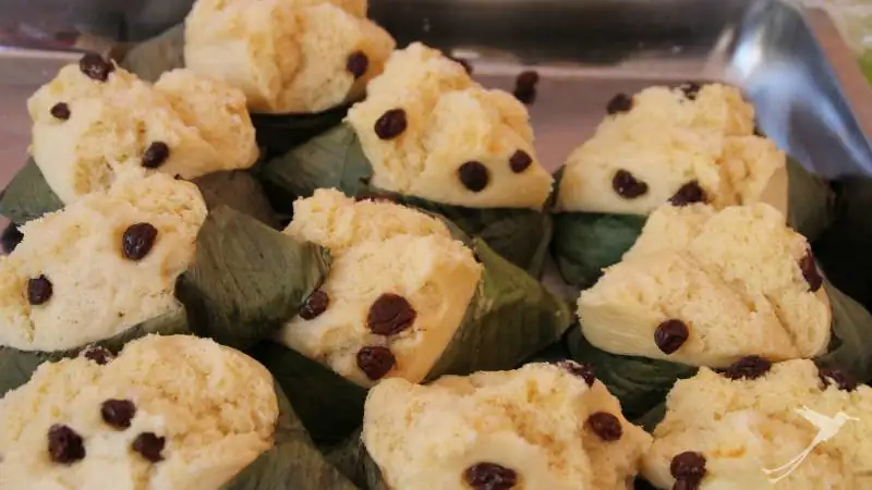 Quimbolitos are a pastry made of grounded corn with raisins and wrapped in corn leaves.