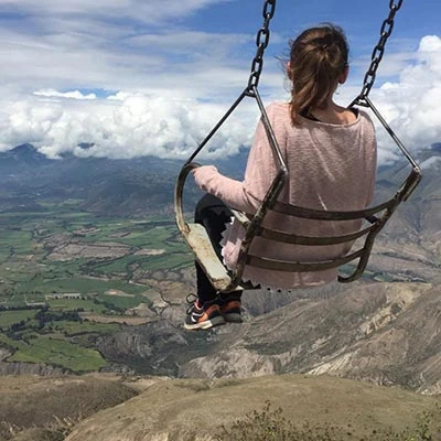 intern Maria O. on a swing at el Angel national Park