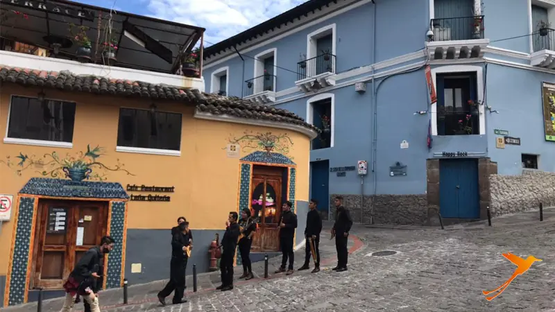 buildings and people in the historic city center of Quito