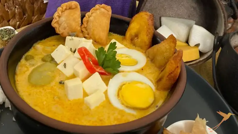 plate of Fanesca with eggs cheese and Empanadas