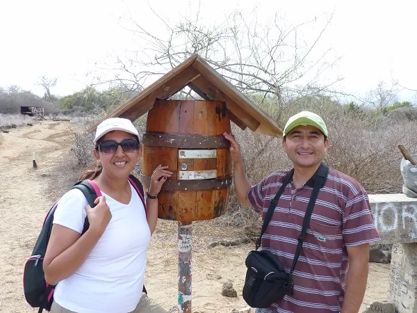 Diego and Lorena in front of the post barrel