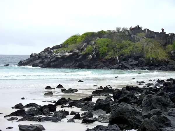 beach with dark rocks on Puerto Chino