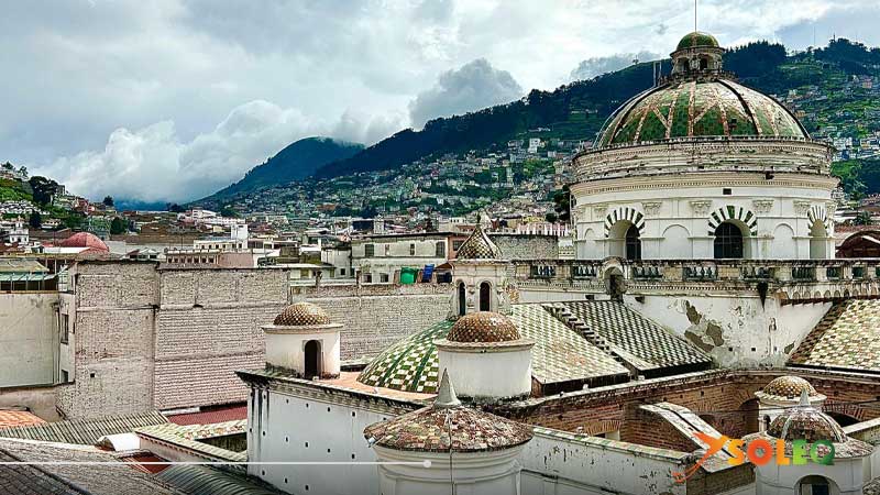 Panoramic view of Quito with mountains from cathedral domes