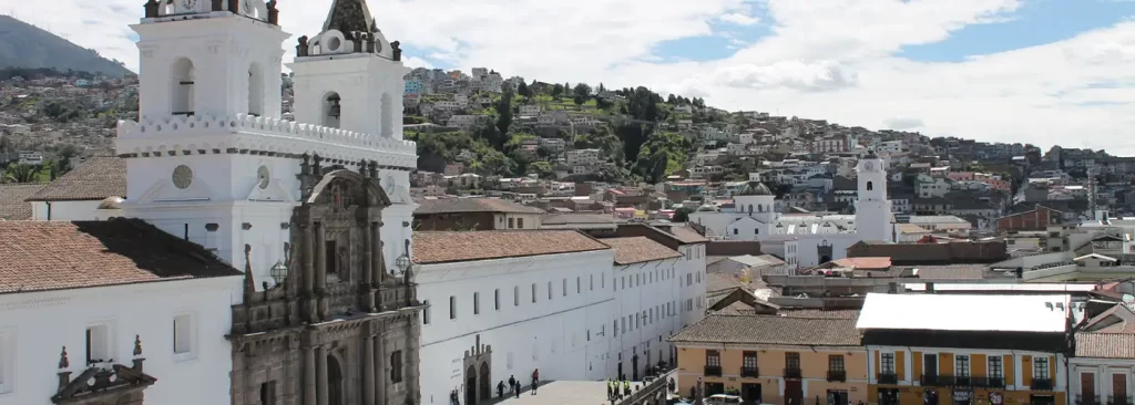 San Francisco Church and Plaza in Quito’s Historic Center, a colonial masterpiece surrounded by traditional architecture and Andean hills.