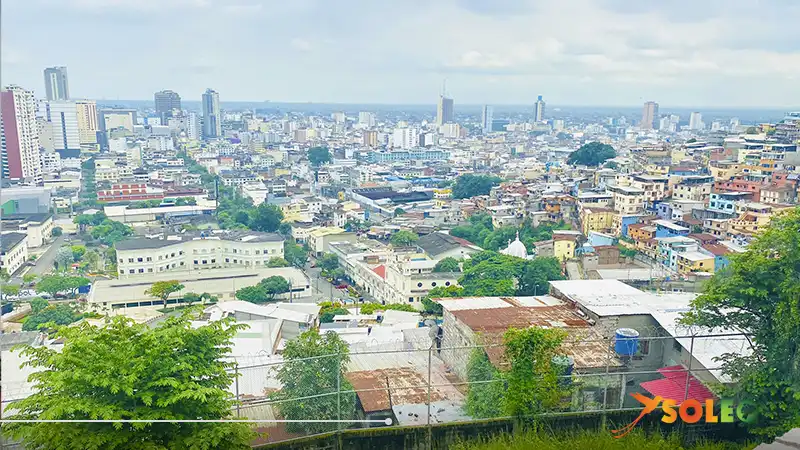 Panoramic view of Guayaquil from Las Peñas hill with colorful houses and modern skyline.
