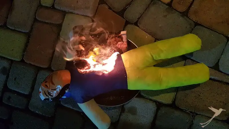 old year figure getting burned