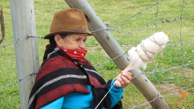 indigenous woman working with wool